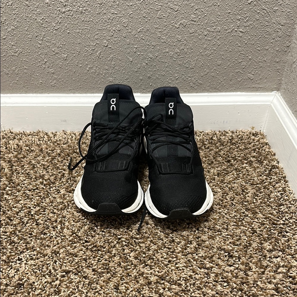 On Running Black Athletic Shoes with White Soles